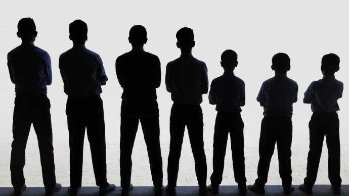A group of people standing next to each other